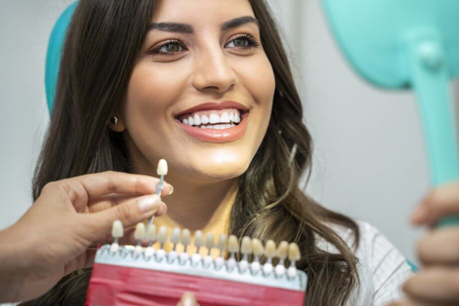 woman reviewing teeth with doctor